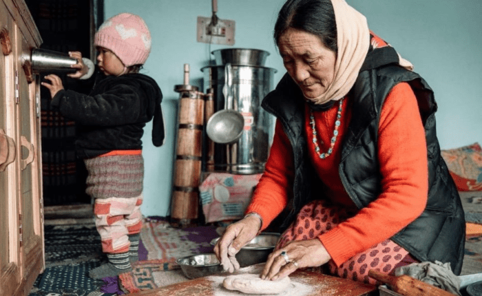 A Ladakhi host preparing traditional food