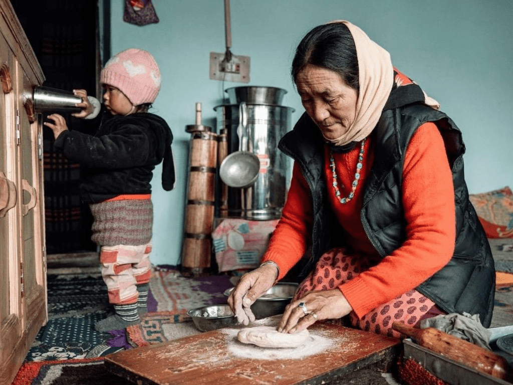 A Ladakhi host preparing traditional food